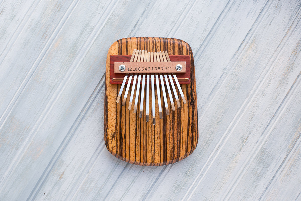 Zebrawood 12 Key Thumbp Piano